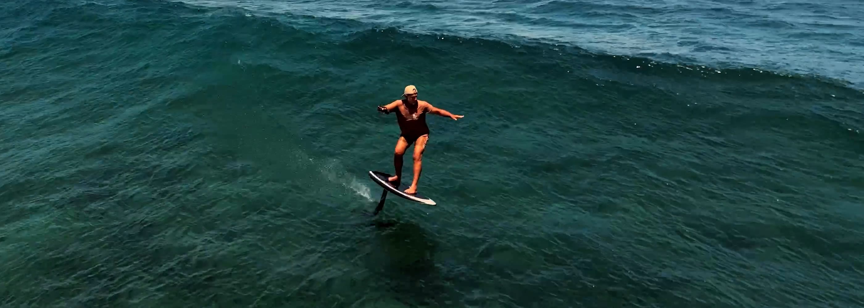 Rider carving across the water on a Lift eFoil at speed