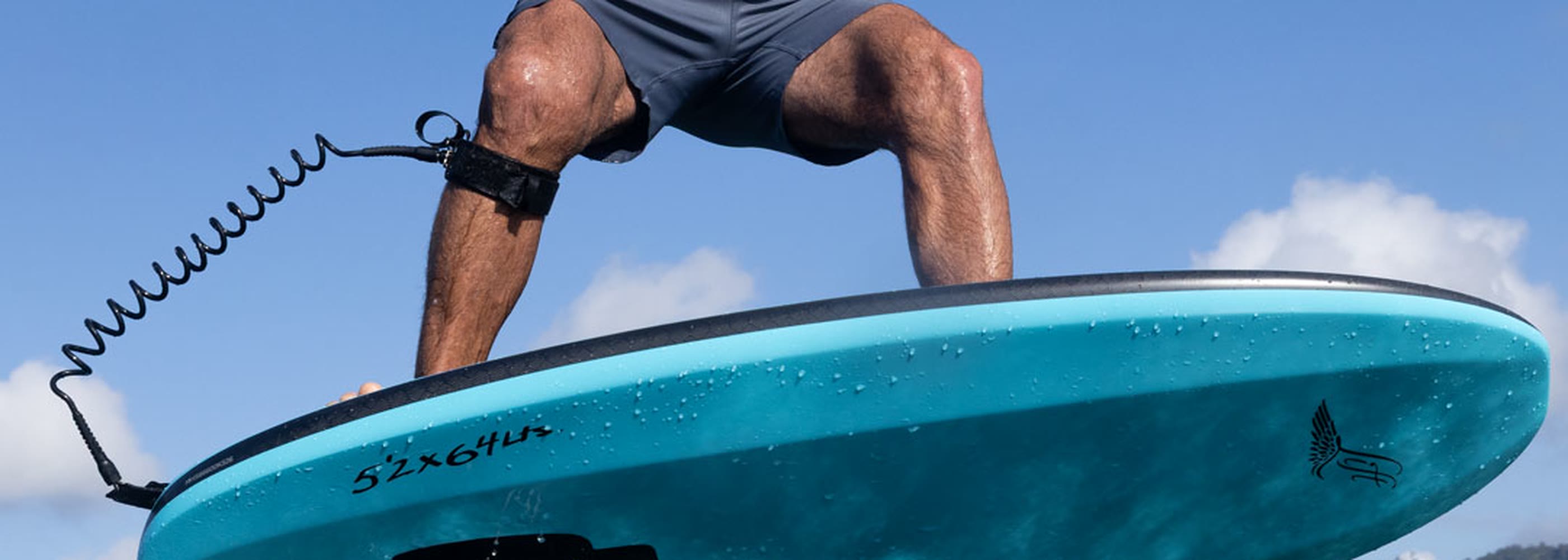 Rider standing on a Lift eFoil board flying above tropical water